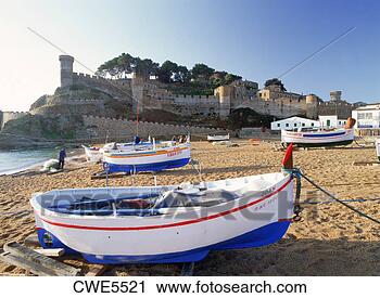 Stock Photography - fishing boats 
below castle at 
tossa de mar in 
girona province 
of. fotosearch 
- search stock 
photos, pictures, 
images, and photo 
clipart