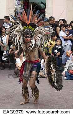Stock Photograph - an aztec dancer 
dressed as a warrior 
with headdress, 
 rattle and. fotosearch 
- search stock 
photos, pictures, 
images, and photo 
clipart