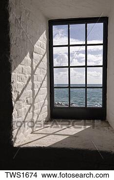 Stock Photo - morning sunlight 
casts strong shadow 
patterns from 
lighthouse window. 
fotosearch - search 
stock photos, 
pictures, images, 
and photo clipart