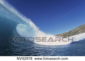 Stock Photo - curl of a wave 
crashing on a 
beautiful sunny 
day in maui, hawaii. 
fotosearch - search 
stock photos, 
pictures, images, 
and photo clipart