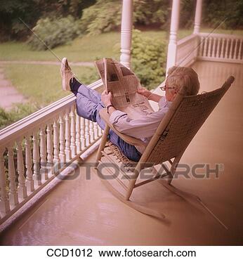 Stock Photo - mature,  white-hair 
 man sitting on 
a rocking chair 
on the front. 
fotosearch - search 
stock photos, 
pictures, images, 
and photo clipart