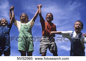 Stock Image - young, happy children 
jumping up and 
down while outside 
on a sunny day. 
fotosearch - search 
stock photos, 
pictures, images, 
and photo clipart