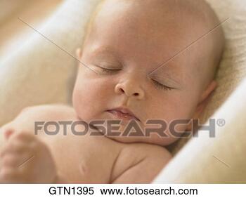 Stock Image - medium close up 
of a beautiful 
baby peacfully 
asleep facing 
camera. fotosearch 
- search stock 
photos, pictures, 
images, and photo 
clipart