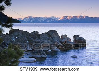Stock Photograph - rocks on the east 
shore of lake 
tahoe on a sunny 
day in winter. 
fotosearch - search 
stock photos, 
pictures, images, 
and photo clipart