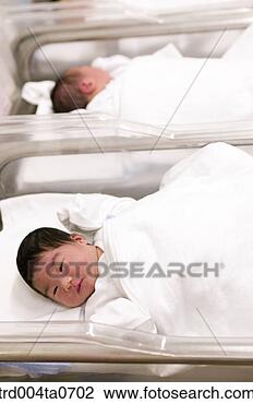 Stock Photo - lying newborn 
babies in a bed. 
fotosearch - search 
stock photos, 
pictures, images, 
and photo clipart