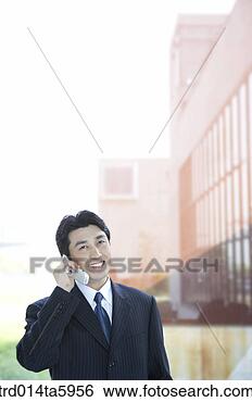 Stock Photo - a businessman 
calling with a 
mobile phone. 
fotosearch - search 
stock photos, 
pictures, images, 
and photo clipart