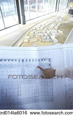 Stock Photo - a businessman 
pointing at something 
with his finger. 
fotosearch - search 
stock photos, 
pictures, images, 
and photo clipart