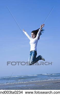 Stock Photo - a woman in a seashore. 
fotosearch - search 
stock photos, 
pictures, images, 
and photo clipart