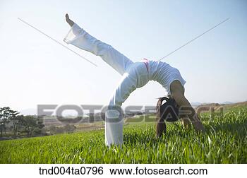 Stock Photo - yoga/ a woman 
doing yoga. fotosearch 
- search stock 
photos, pictures, 
images, and photo 
clipart