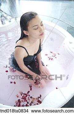 Stock Photo - woman taking bath, 
high angle. fotosearch 
- search stock 
photos, pictures, 
images, and photo 
clipart