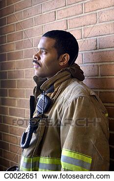 Stock Photography - brick, looking, 
portrait, profile, 
two-way radio, 
uniform, serious. 
fotosearch - search 
stock photos, 
pictures, images, 
and photo clipart