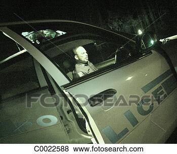 Stock Photo - green, car, night, 
police, sitting, 
uniform, working. 
fotosearch - search 
stock photos, 
pictures, images, 
and photo clipart