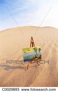 Stock Photo - bird’s eyeview 
of easel with 
painting casting 
shadow in the 
sand. fotosearch 
- search stock 
photos, pictures, 
images, and photo 
clipart