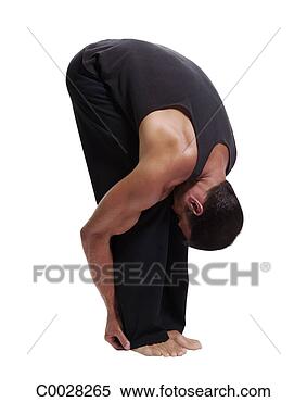 Stock Image - a man practices 
yoga, bending 
at the waist and 
grasping his legs. 
fotosearch - search 
stock photos, 
pictures, images, 
and photo clipart