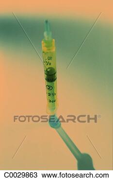 Stock Photo - orange and green 
tone still life 
of a hypodermic 
needle. fotosearch 
- search stock 
photos, pictures, 
images, and photo 
clipart