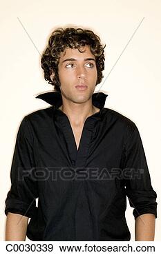 Stock Photograph - fashion portrait 
of a young man 
in a black shirt 
with the collar 
up. fotosearch 
- search stock 
photos, pictures, 
images, and photo 
clipart