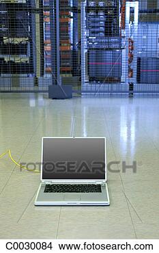 Stock Photo - a laptop computer 
sits on the floor 
connected to the 
computer servers. 
fotosearch - search 
stock photos, 
pictures, images, 
and photo clipart
