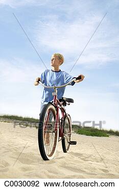 Stock Photo - portrait of a 
boy looking off 
into the distance 
as he walks his. 
fotosearch - search 
stock photos, 
pictures, images, 
and photo clipart