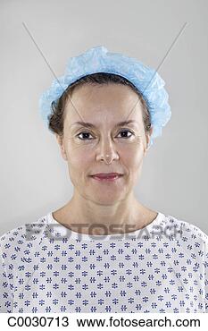 Stock Photo - portrait of a 
woman wearing 
a gown and medical 
cap in preparation 
for. fotosearch 
- search stock 
photos, pictures, 
images, and photo 
clipart