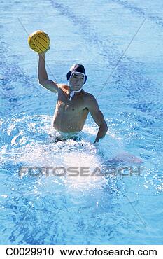 Stock Photography - a water polo player 
lifts out of the 
water to pass 
the ball toward. 
fotosearch - search 
stock photos, 
pictures, images, 
and photo clipart