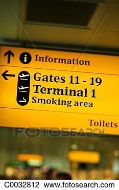 Stock Photo - an airport sign 
indicating which 
direction to go 
for information. 
fotosearch - search 
stock photos, 
pictures, images, 
and photo clipart