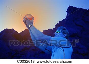 Stock Photo - blue tone of a 
futuristic man 
holding an orange 
glowing orb up 
with. fotosearch 
- search stock 
photos, pictures, 
images, and photo 
clipart