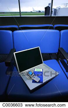 Stock Photo - blue toned still-life 
of a laptop, cell 
phone and airline 
ticket. fotosearch 
- search stock 
photos, pictures, 
images, and photo 
clipart