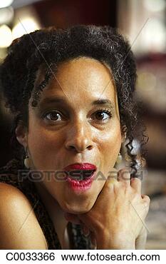 Stock Photo - close-up headshot 
of a woman looking 
to her side with 
a surprised. fotosearch 
- search stock 
photos, pictures, 
images, and photo 
clipart