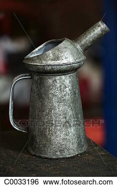 Stock Photo - close-up of a 
metal oil can 
at an auto mechanic 
shop. fotosearch 
- search stock 
photos, pictures, 
images, and photo 
clipart
