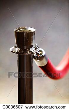 Picture - close-up view 
of red rope barrier. 
fotosearch - search 
stock photos, 
pictures, images, 
and photo clipart