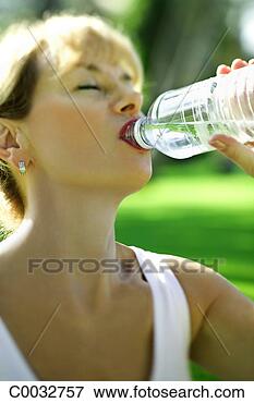 Picture - close-up of a 
woman drinking 
from a water bottle. 
fotosearch - search 
stock photos, 
pictures, images, 
and photo clipart
