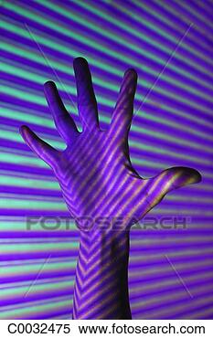 Stock Image - close-up of a 
woman’s palm spread 
wide with violet, 
 blue and green. 
fotosearch - search 
stock photos, 
pictures, images, 
and photo clipart