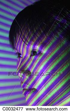 Picture - close-up of a 
woman’s face with 
violet,  blue 
and green lines. 
fotosearch - search 
stock photos, 
pictures, images, 
and photo clipart