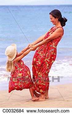 Stock Photo - a daughter and 
mother wearing 
the same print 
dress holding 
hands. fotosearch 
- search stock 
photos, pictures, 
images, and photo 
clipart