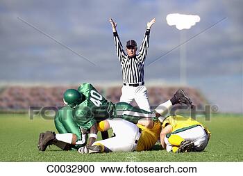 Stock Photography - football players 
tackled to the 
ground with the 
referee behind 
them. fotosearch 
- search stock 
photos, pictures, 
images, and photo 
clipart