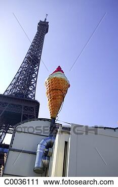 Stock Photography - low angle of a 
sign in the shape 
of an ice cream 
cone beside the. 
fotosearch - search 
stock photos, 
pictures, images, 
and photo clipart