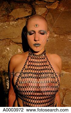 Stock Photo - woman in mesh 
top with third 
eye up against 
wall with her 
eyes closed. fotosearch 
- search stock 
photos, pictures, 
images, and photo 
clipart