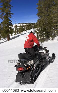 Stock Photo - ski patrol on 
snowmobile. fotosearch 
- search stock 
photos, pictures, 
images, and photo 
clipart