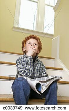 Stock Photograph - child daydreaming 
with homework 
on stairs. fotosearch 
- search stock 
photos, pictures, 
images, and photo 
clipart