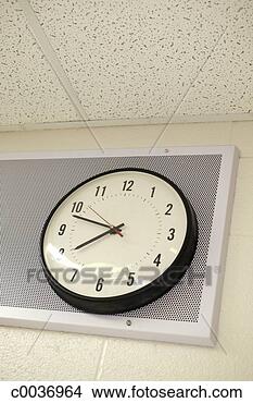Stock Photo - clock on classroom 
wall. fotosearch 
- search stock 
photos, pictures, 
images, and photo 
clipart