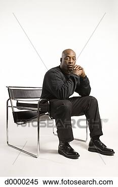 Stock Image - man in chair in 
thoughtful pose. 
fotosearch - search 
stock photos, 
pictures, images, 
and photo clipart