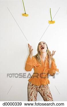 Stock Photograph - woman catching 
flowers. fotosearch 
- search stock 
photos, pictures, 
images, and photo 
clipart