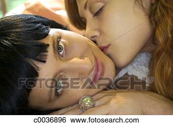 Stock Photo - woman kissing 
her girlfriend. 
fotosearch - search 
stock photos, 
pictures, images, 
and photo clipart