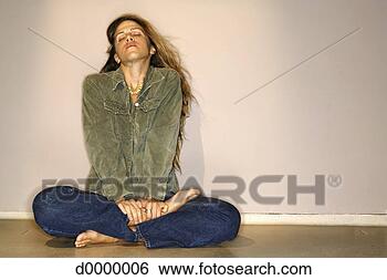 Stock Photo - woman sitting 
in yoga position. 
fotosearch - search 
stock photos, 
pictures, images, 
and photo clipart