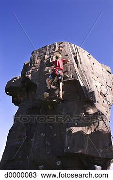 Stock Photo - young man climbing 
artificial rock. 
fotosearch - search 
stock photos, 
pictures, images, 
and photo clipart