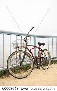 Stock Photo - bicycle against 
railing. fotosearch 
- search stock 
photos, pictures, 
images, and photo 
clipart
