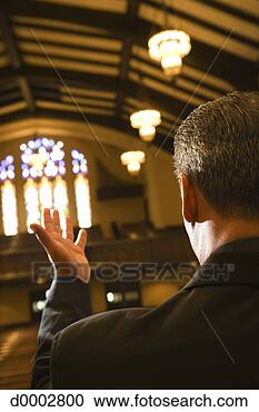 Stock Photography - catholic priest 
at altar. fotosearch 
- search stock 
photos, pictures, 
images, and photo 
clipart