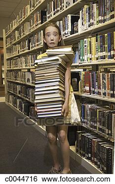 Stock Photo - girl carrying 
an enormous stack 
of library books. 
fotosearch - search 
stock photos, 
pictures, images, 
and photo clipart