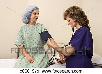 Stock Image - nurse taking patient's 
blood pressure. 
fotosearch - search 
stock photos, 
pictures, images, 
and photo clipart