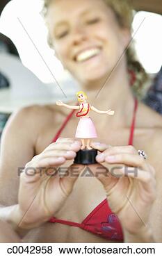 Stock Photo - woman playing 
with a  toy. fotosearch 
- search stock 
photos, pictures, 
images, and photo 
clipart